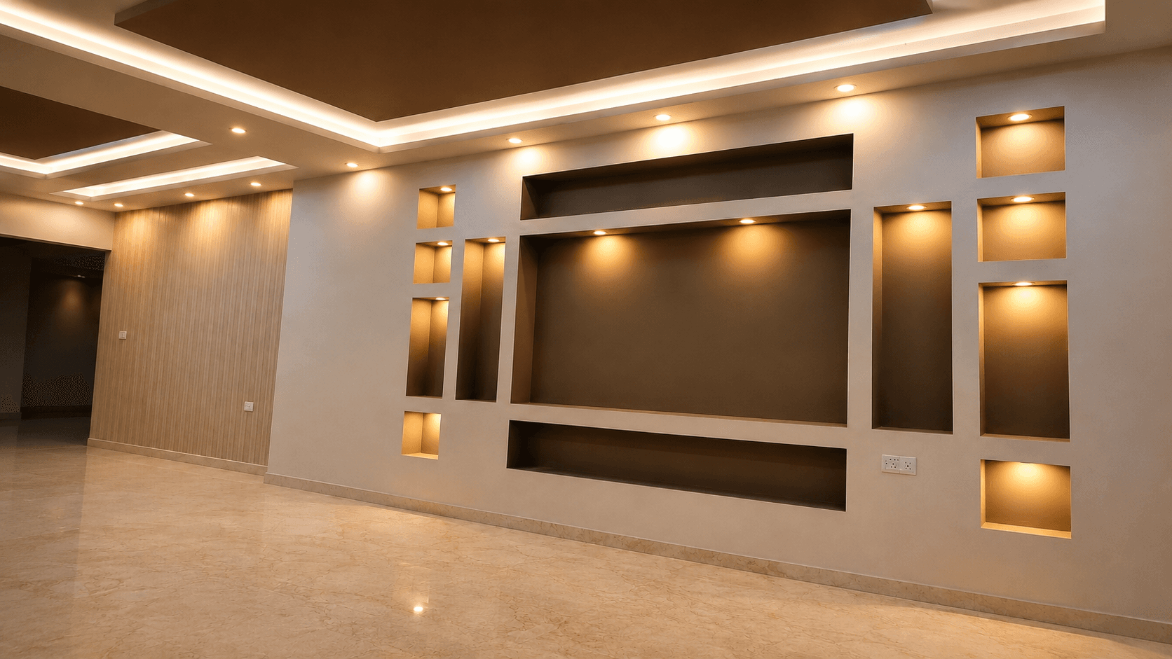 Living room feature wall with lit display niches and warm lighting